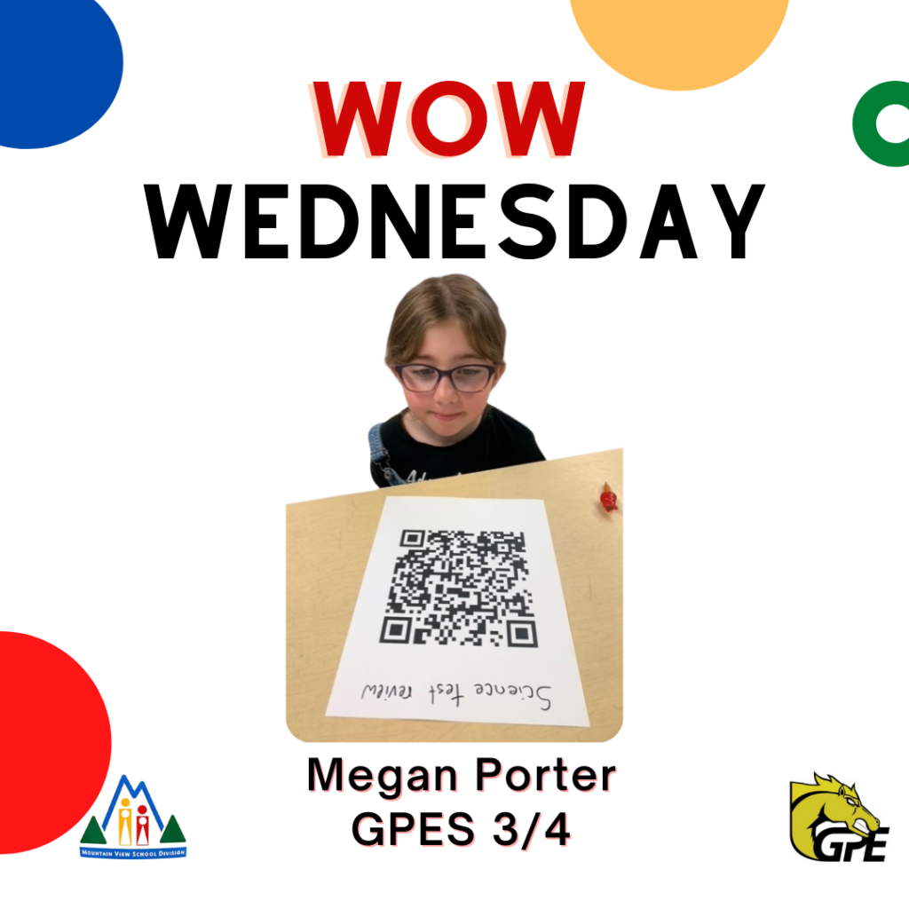 WOW Wednesday, image of a Gr 3 student sitting at a desk looking at a QR code, Megan Porter, GPES grade 3/4